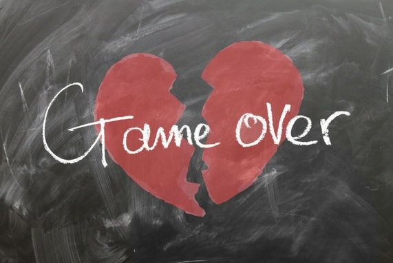 Lust Expires: Stop Playing, image of chalk board with a broken heart drawn with game over written over it.