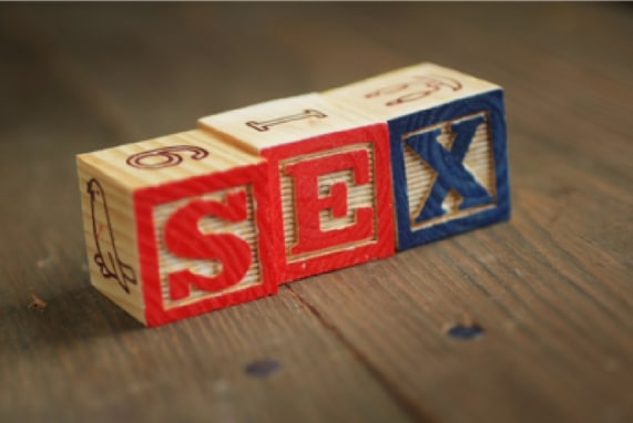 Summer 100. Sex Toys: The History, image of blocks with the words sex spelled out