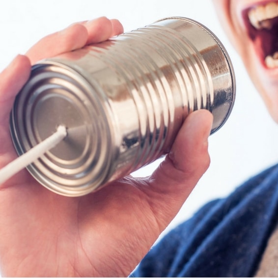 Public service announcement, image of a person holding a can to his mouth attached to a string to simulate a childhood way to communicate.